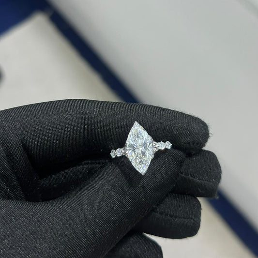 Marquise cut diamond engagement ring in 18k white gold with side stones, custom made in Dubai UAE by Lamae Jewelry